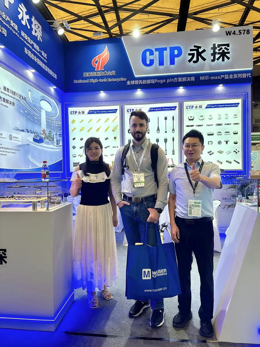 CTP team with an international visitor at booth W4.578