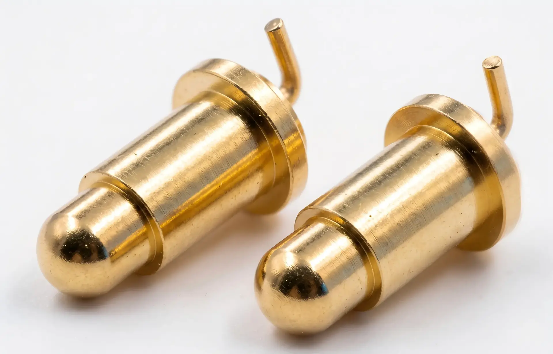 Right angle bending pogo pin contacts specifically designed for space-saving, side-entry board-to-board connections.